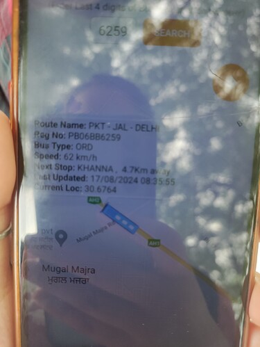 A close-up of a phone screen displaying the location, route details and estimated time of arrival of a bus. (Captioned by AI)